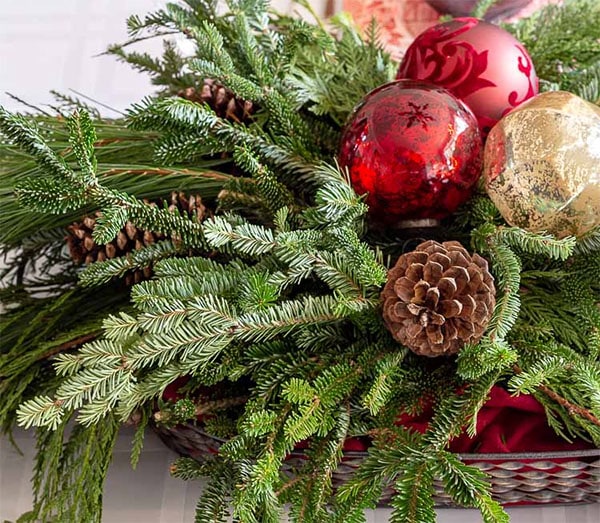 Christmas Table Centerpiece Made with Evergreens & Ornaments