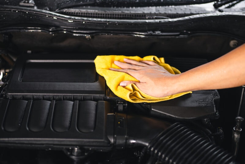 Cleaning the engine bay with ye;;pw rug