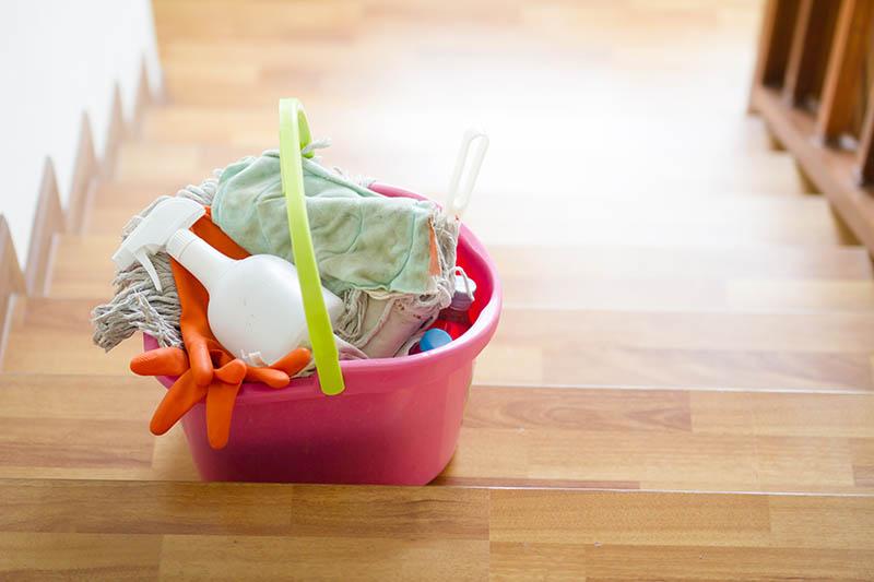 Cleaning tools in bucket on stair are prepare to cleaning