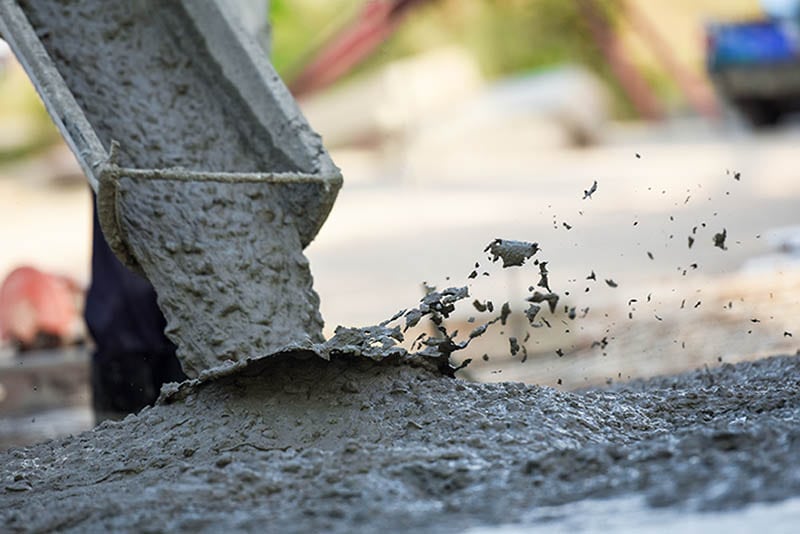 Concrete pouring during commercial concreting floors of building
