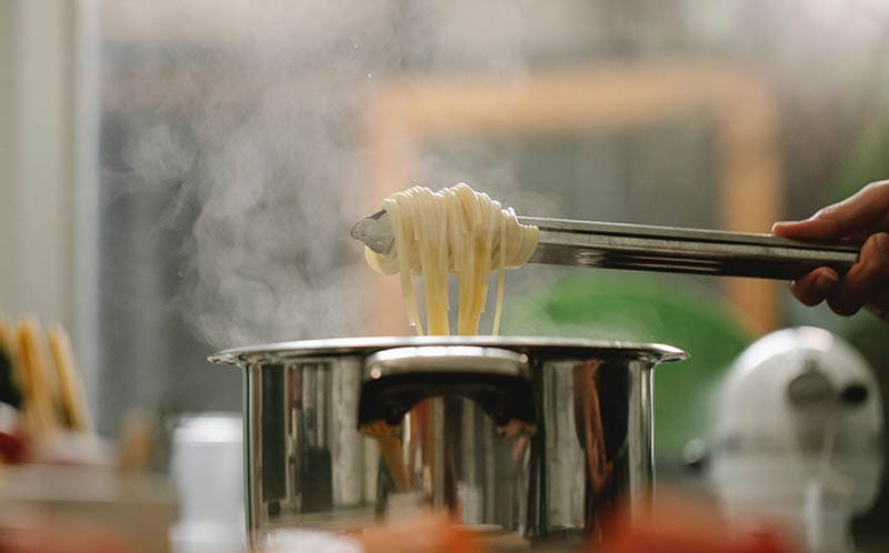 Cooking pasta in a stainless steel cookware