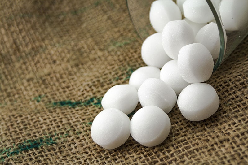 Mothballs in the glass over the sackcloth