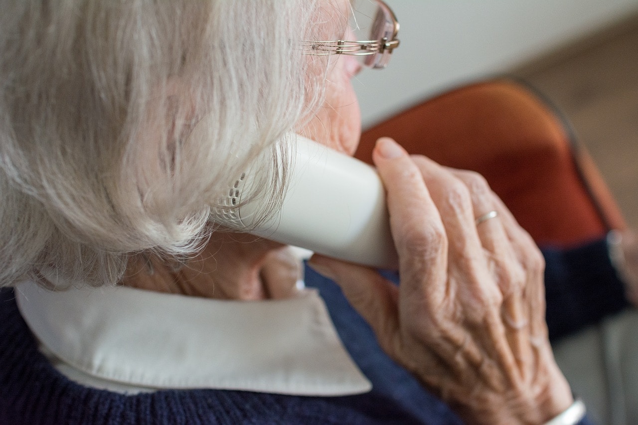 Old Lady talking to the phone