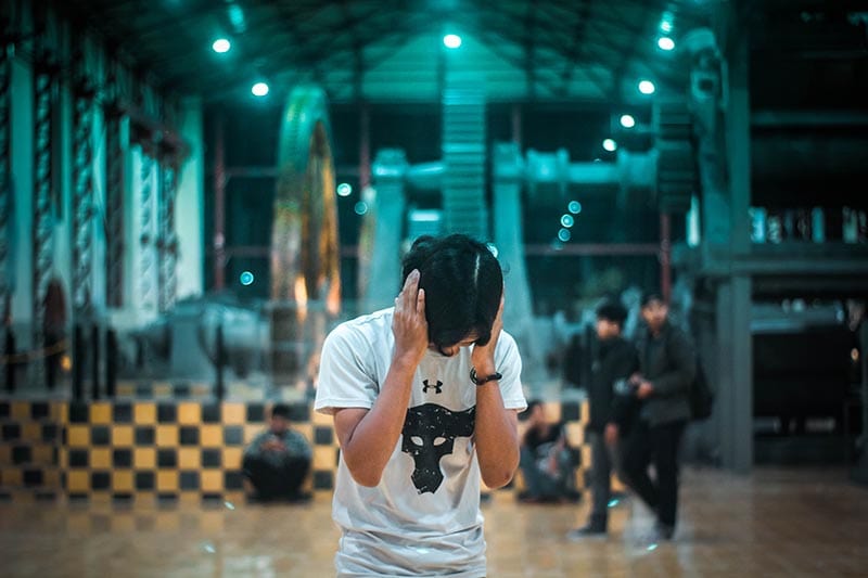 Person covering his ears