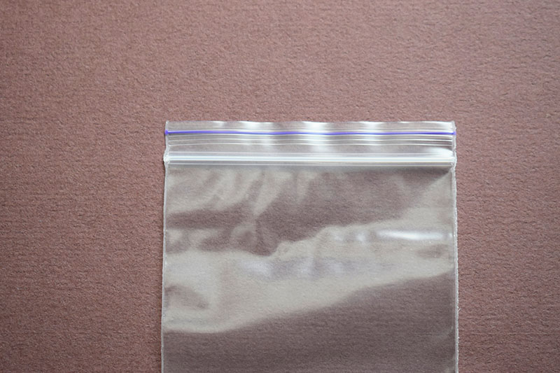 Small transparent plastic bag with zip clasp