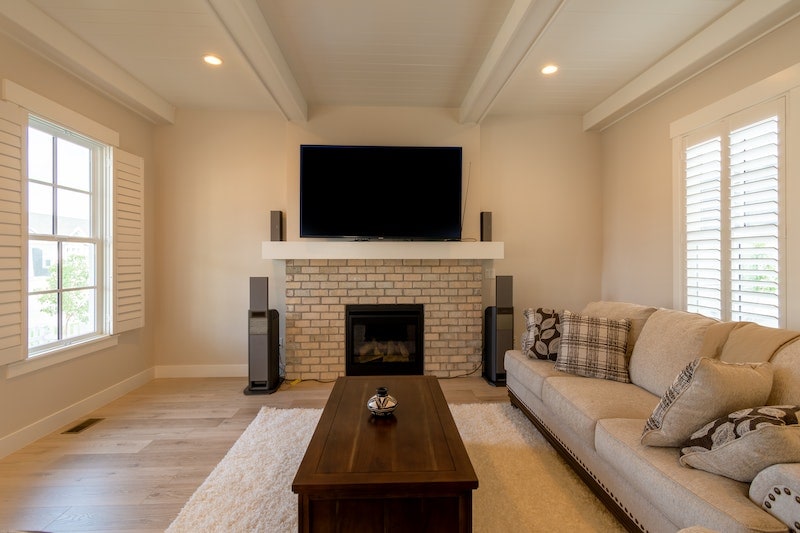 TV with mantel over fireplace