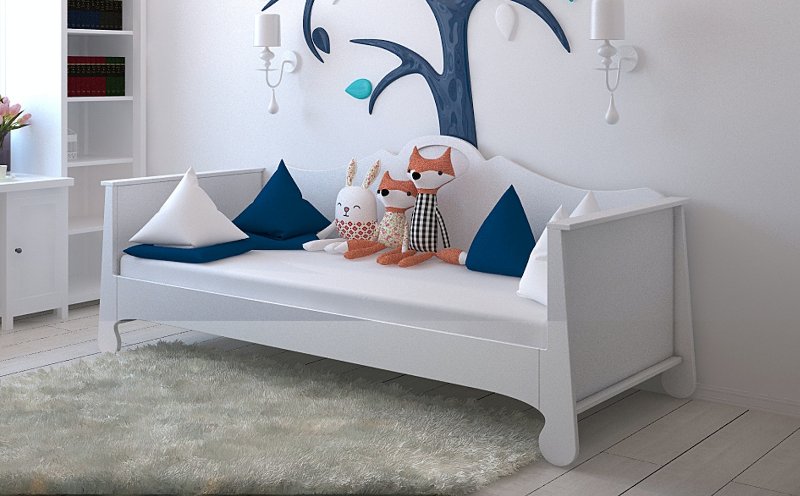 a child's white wooden bed