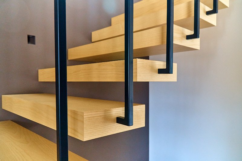 ash lumber floating stairs with steel railing