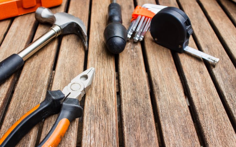 assorted tools on a wooden platform