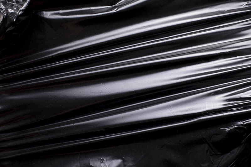 creased black plastic