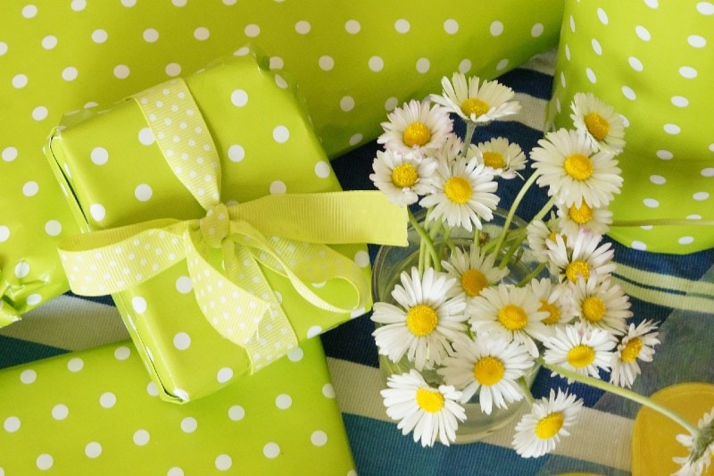 gifts wrapped in green polka dots wrapper