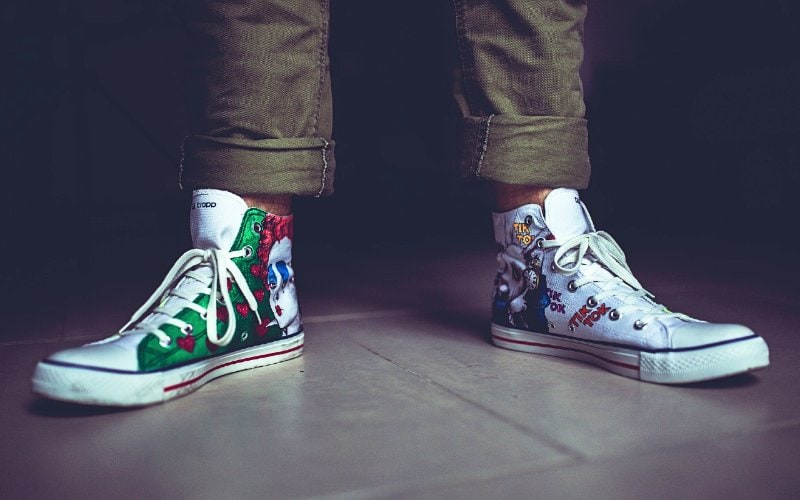 hand-painted old white canvas shoes