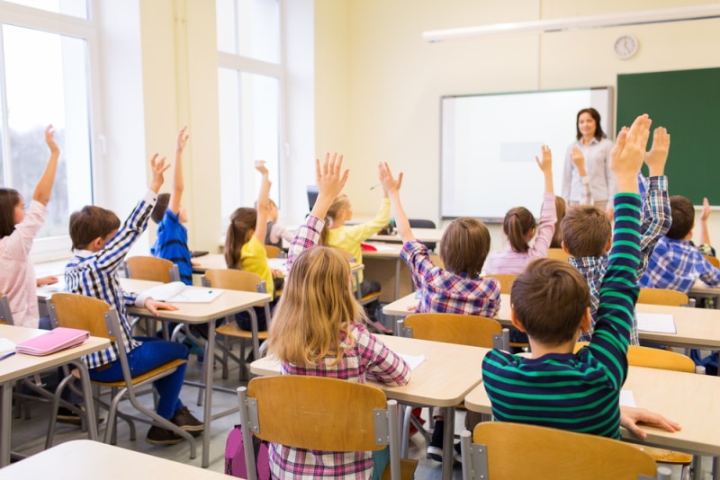 kids and teacher in the class room