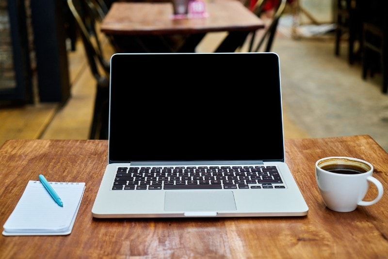 laptop on wooden table