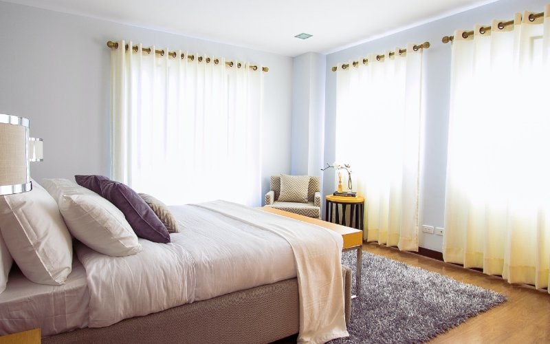 light airy bedroom with white curtains