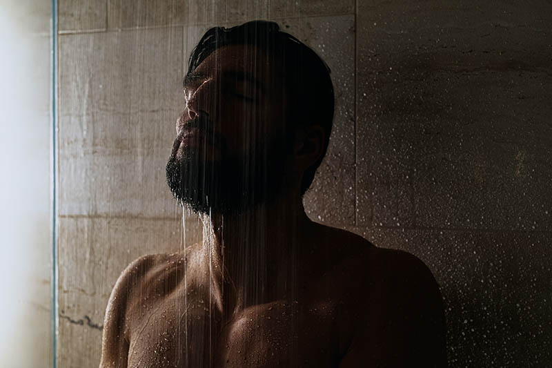 man enjoying a shower