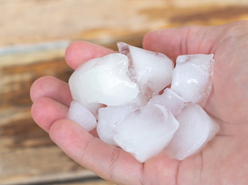 man holding ice cubes