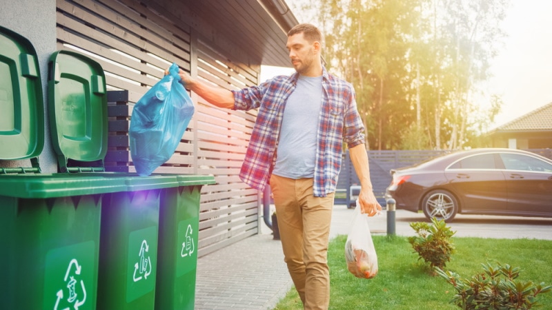 man throwing garbage