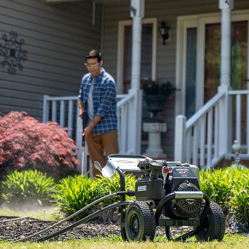 man using SIMPSON Cleaning MSH3125 MegaShot Gas Pressure Washer