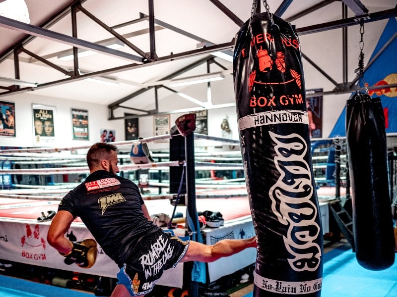 man with punching bag