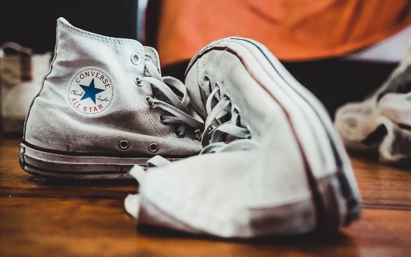 old pair of white canvas shoes