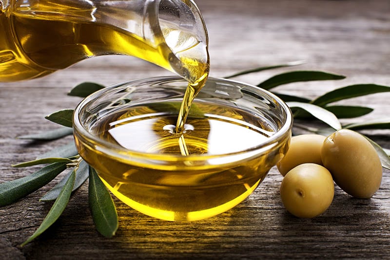 pouring vegetable oil in a bowl