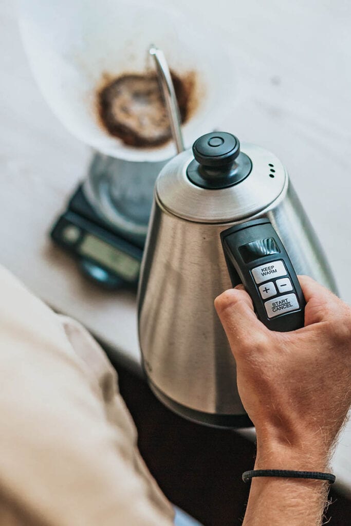 pouring water from electric kettle