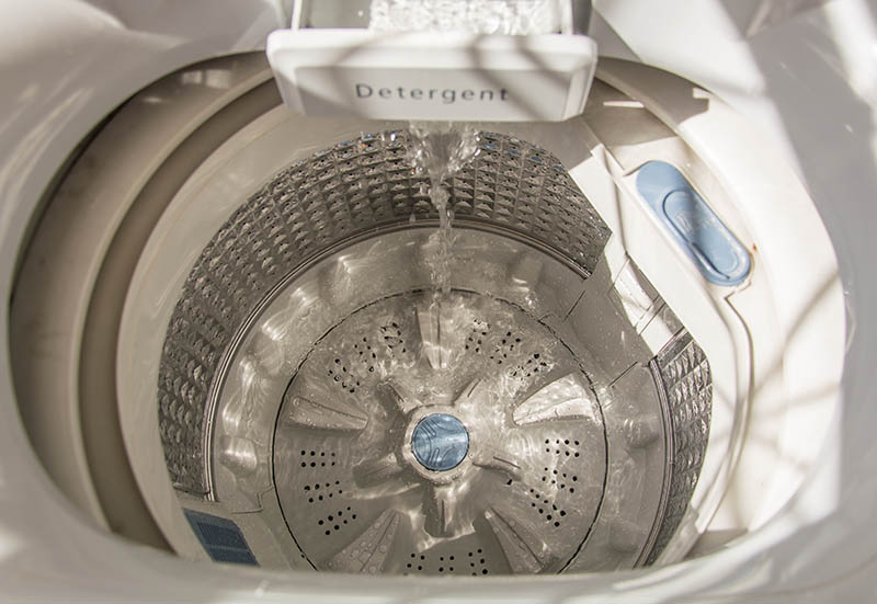 pouring water in washing machine