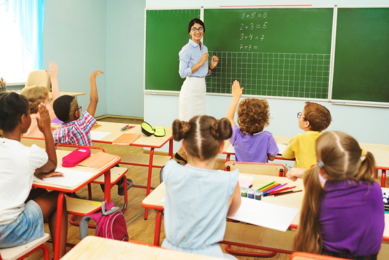 pupils and teacher in the classroom