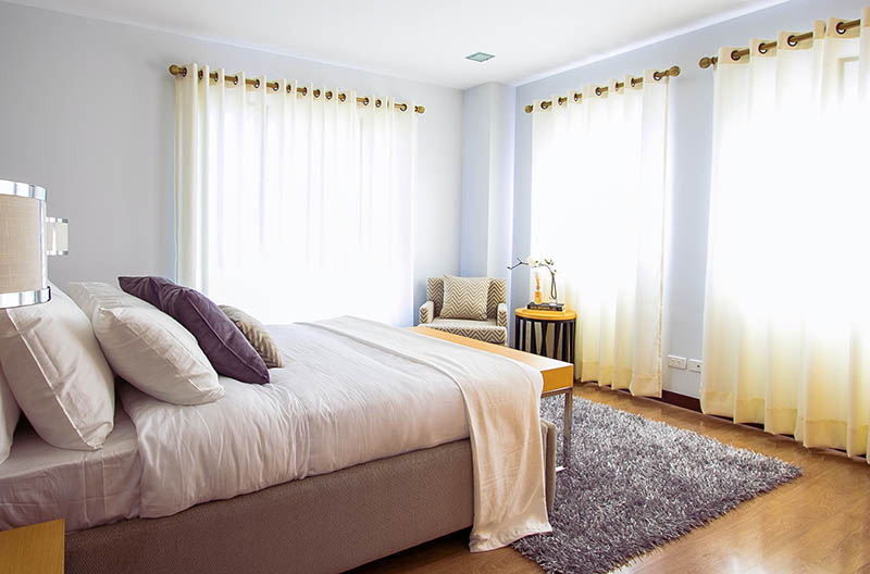 room with curtains and bed
