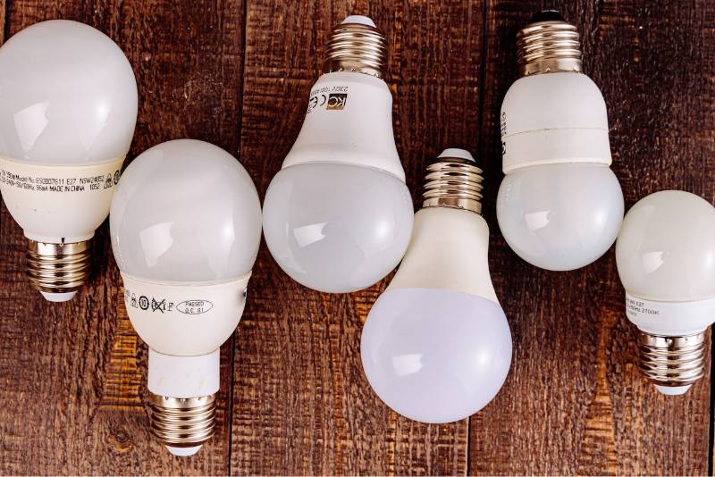 several light bulbs on a wooden surface