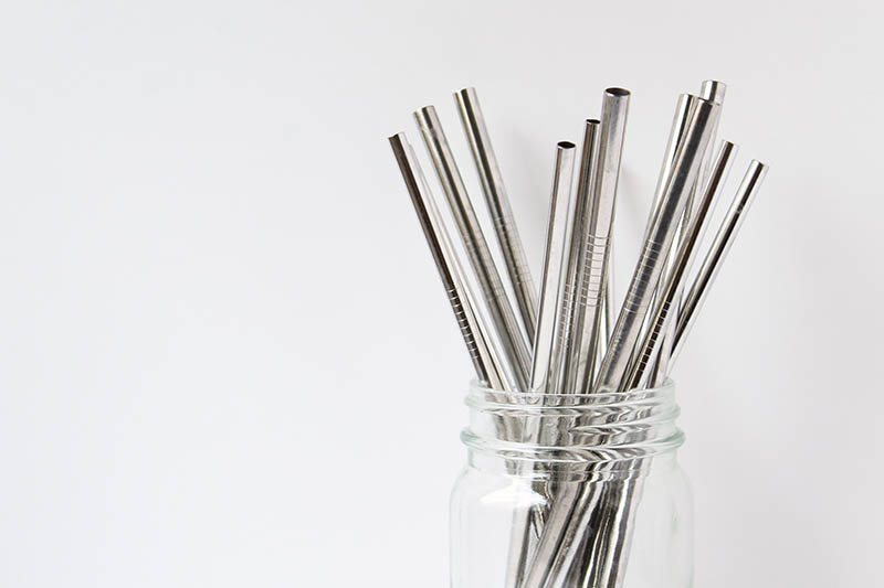 stainless steel straw in a clear glass