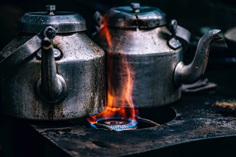 stainless tea kettles on the stove