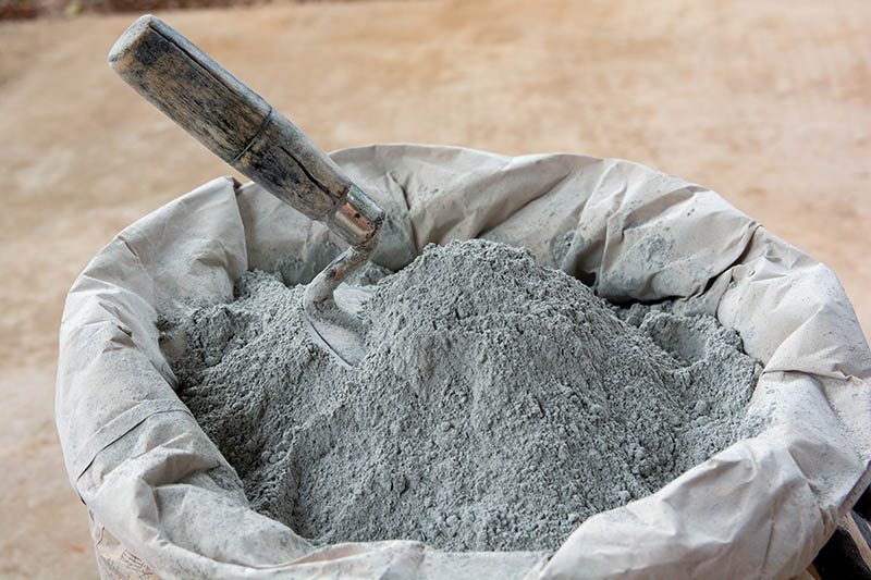 trowel on a bag of cement