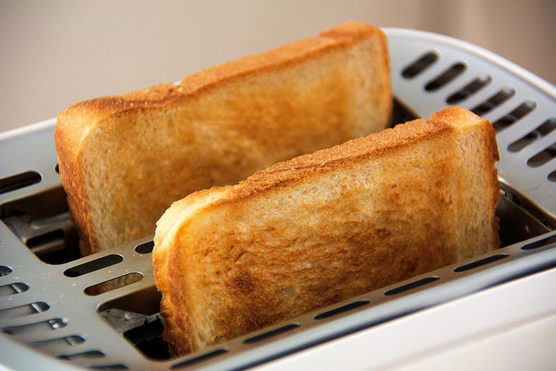 two sliced breads in a toaster