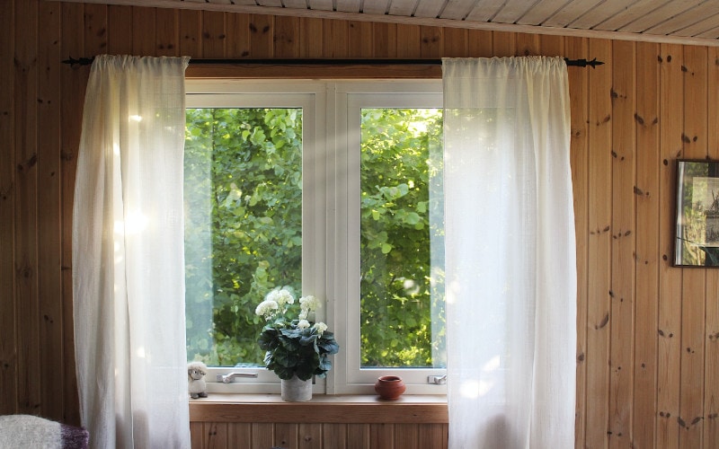 white curtains on a cabin window