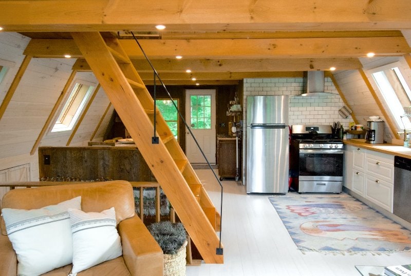 wooden stair ladder going up to the loft