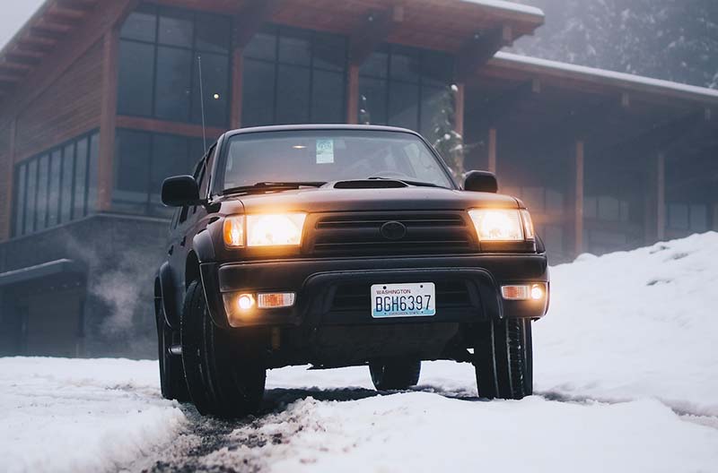 Black Toyota Vehicle on Snow Field at Daytime