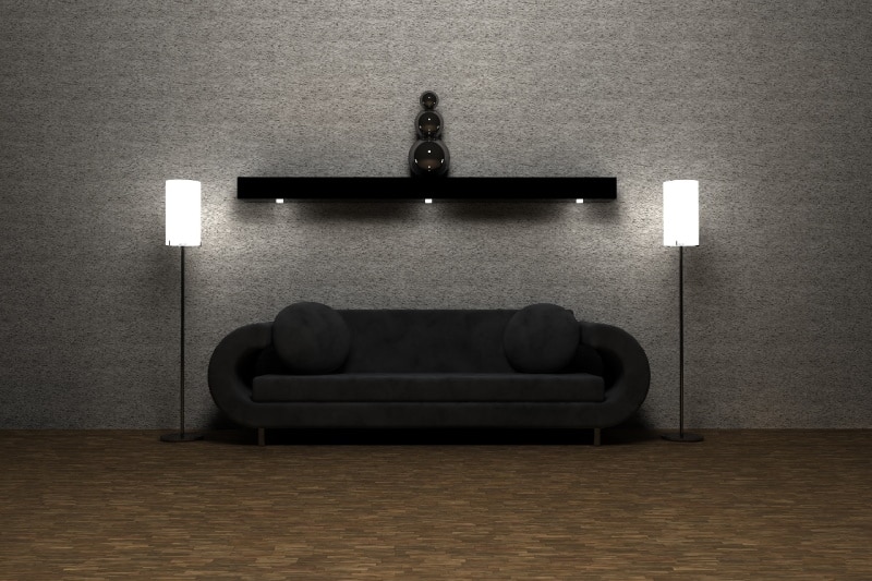 Black couch with black floating shelf above