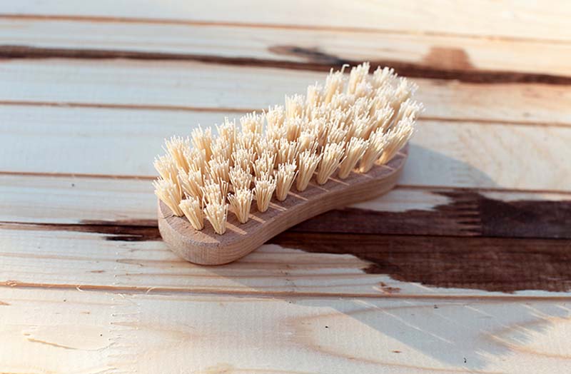 Cleaning brush on wood