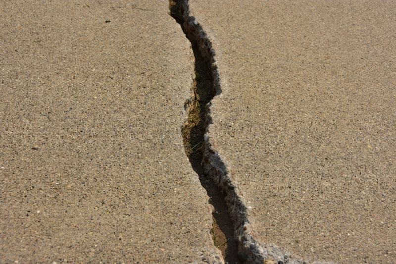 Cracked concrete city sidewalk