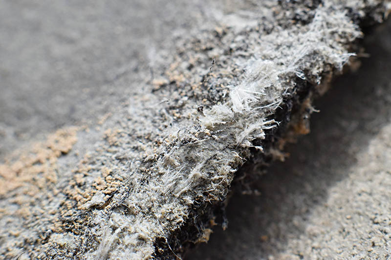 Detailed photography of roof covering material with asbestos fibres