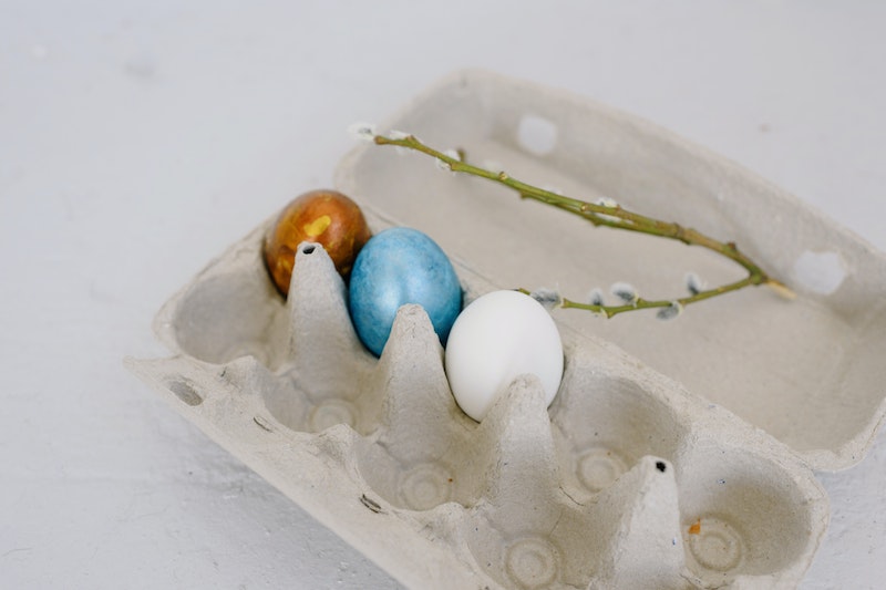 Egg carton with three eggs