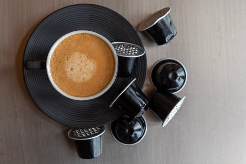Espresso coffee cup with wasted capsules