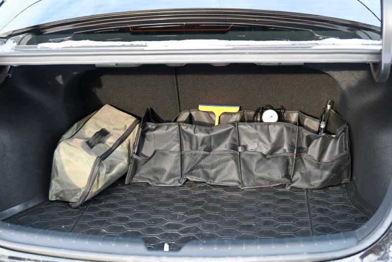 Organizer with items for a car service in the trunk of a car