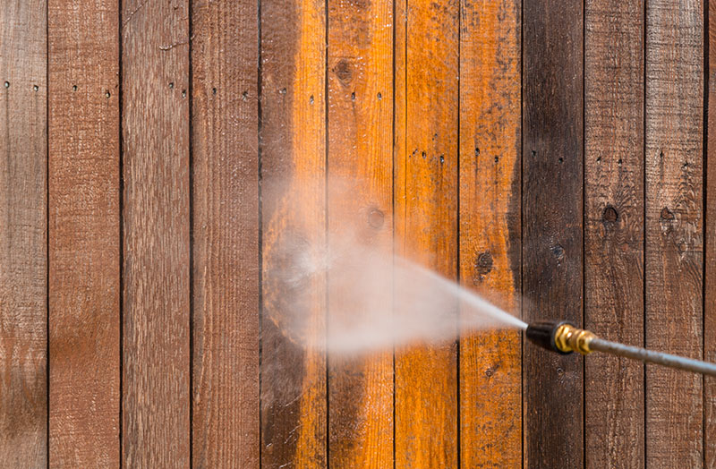 Pressure washing wooden fence