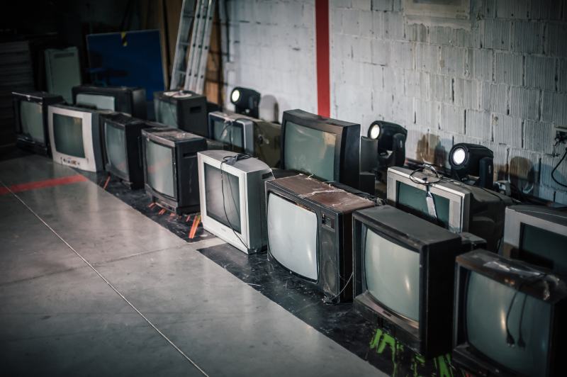 Stack of retro vintage televisions stacked