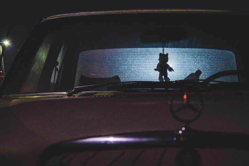 Stuffed toy hanging from rearview mirror