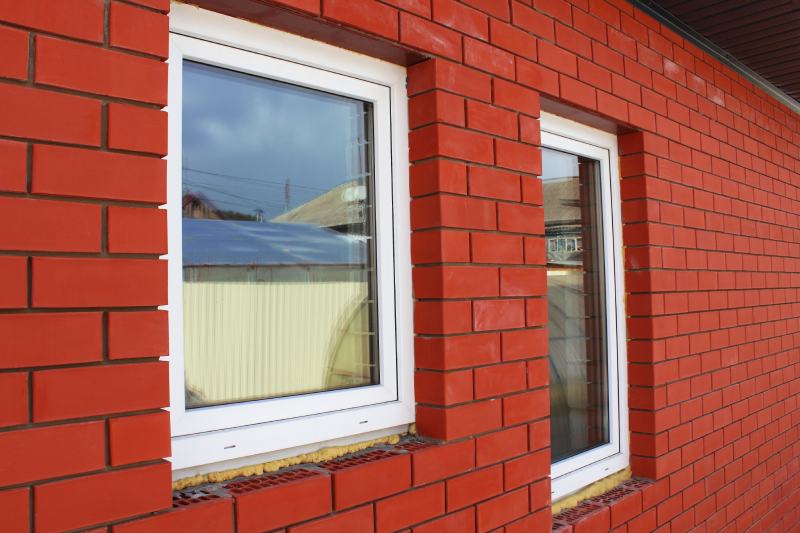 White fiberglass windows in a brick house