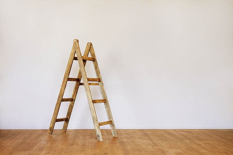 wooden ladder in an empty loft style room